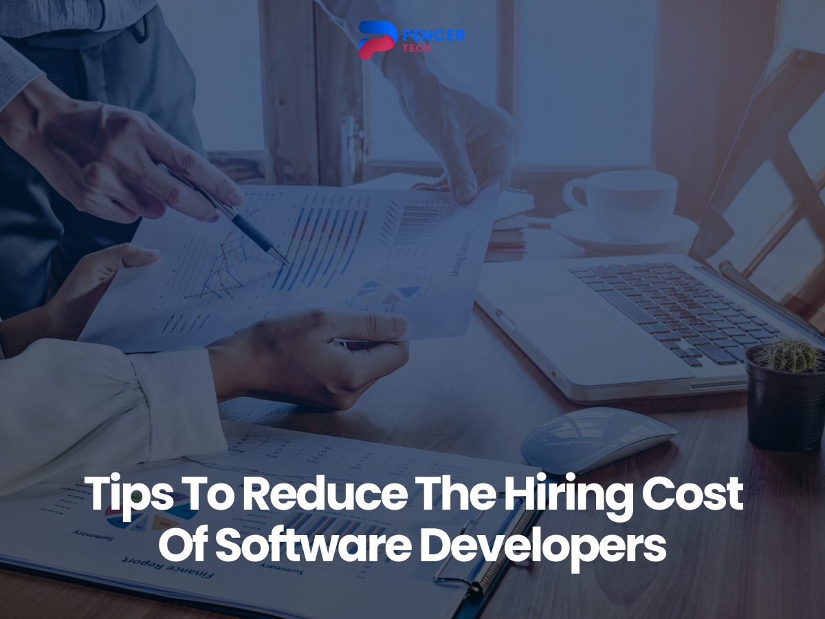 Two individuals analyzing financial reports with charts, graphs, and documents on a desk, accompanied by a laptop and coffee. Text overlay states, "Tips To Reduce The Hiring Cost Of Software Developers.